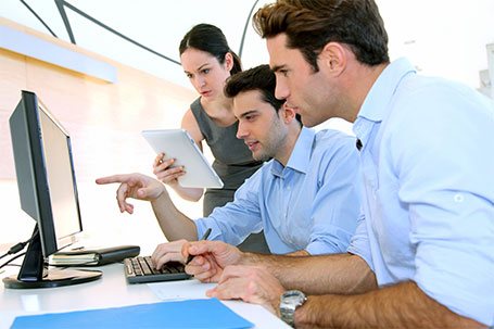 group looking at a computer