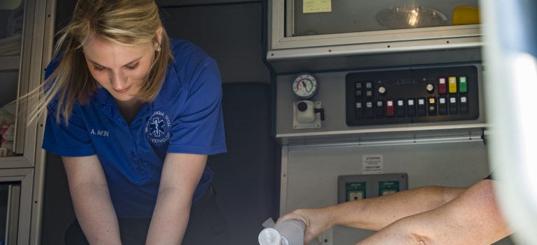 students working in ambulance