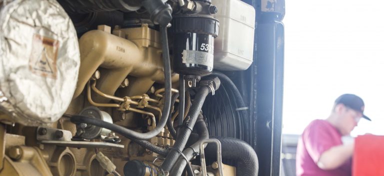 student working on diesel