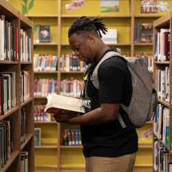 student in library