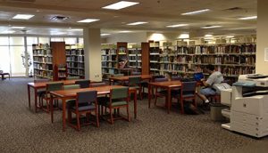 student in library