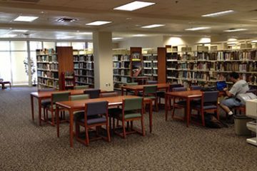 student in library