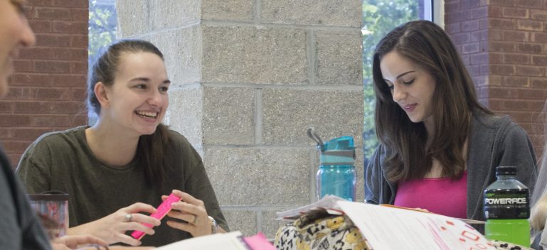 students studying together in student center.