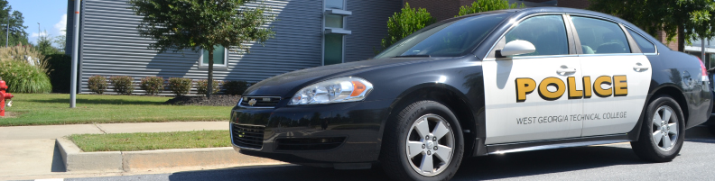 police car in front of campus