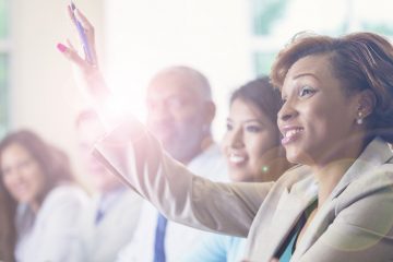 student raising hand