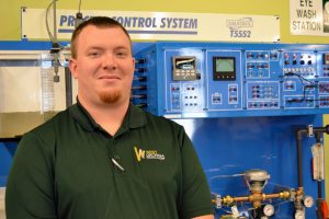 Russell Yeatman standing in front of machinery