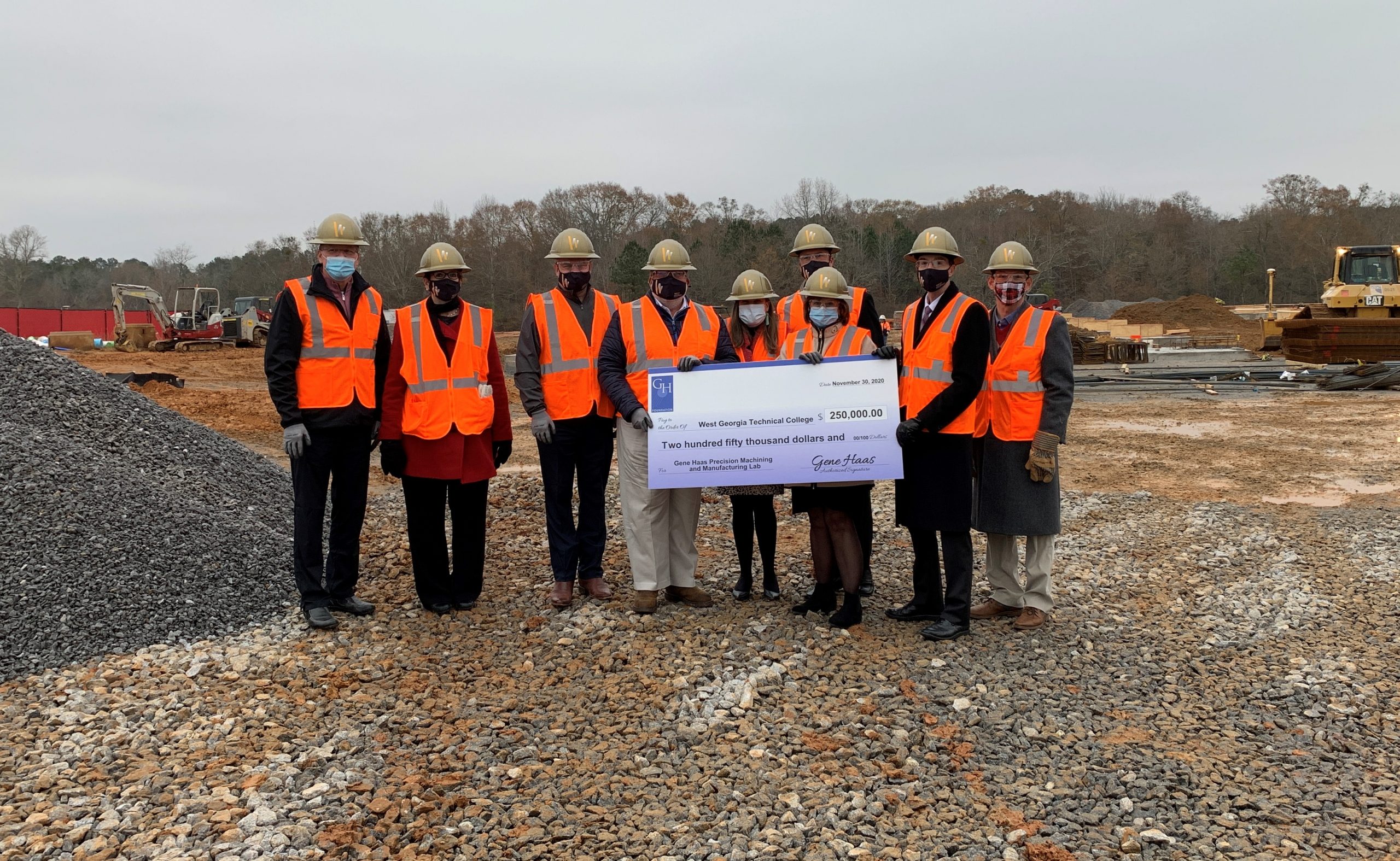 Gene Haas Foundation check presentation at construction site