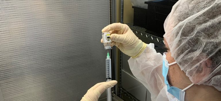 Pharmacy student with needle
