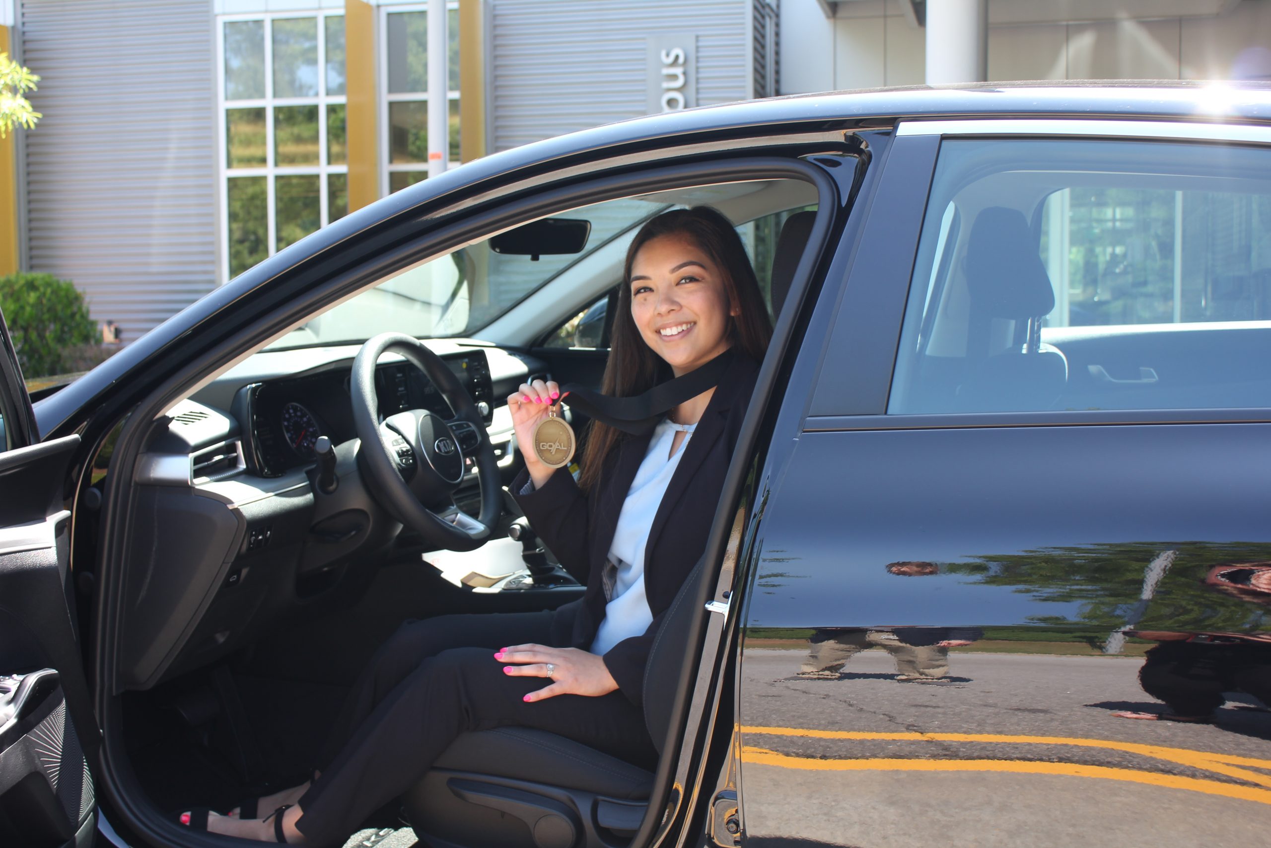 Rodriguez in 2021 Kia car with medal