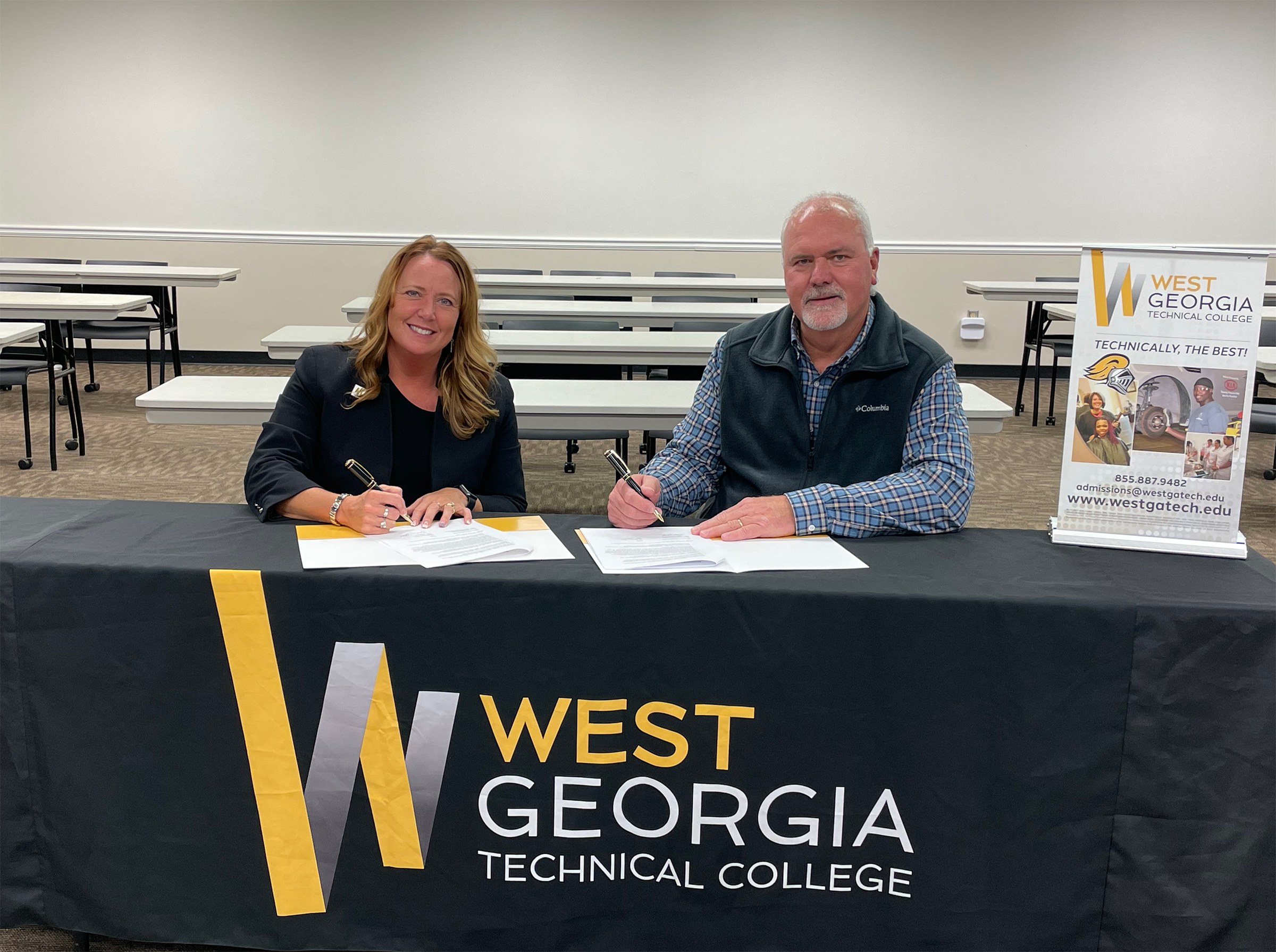 WGTC President Dr. Julie Post and Pilgrim’s Pride Complex Manager Ricky Walker signing agreement