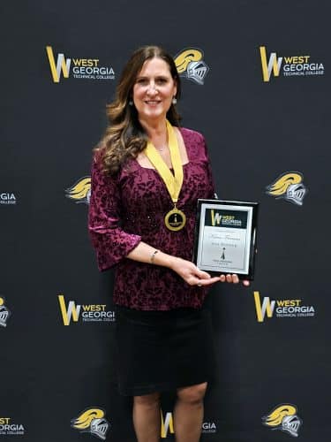 Photo of Karen Freeman with Award