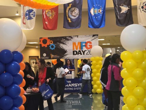 manufacturing day attendees visiting booths