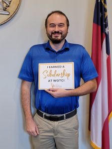 Award recipient holding award