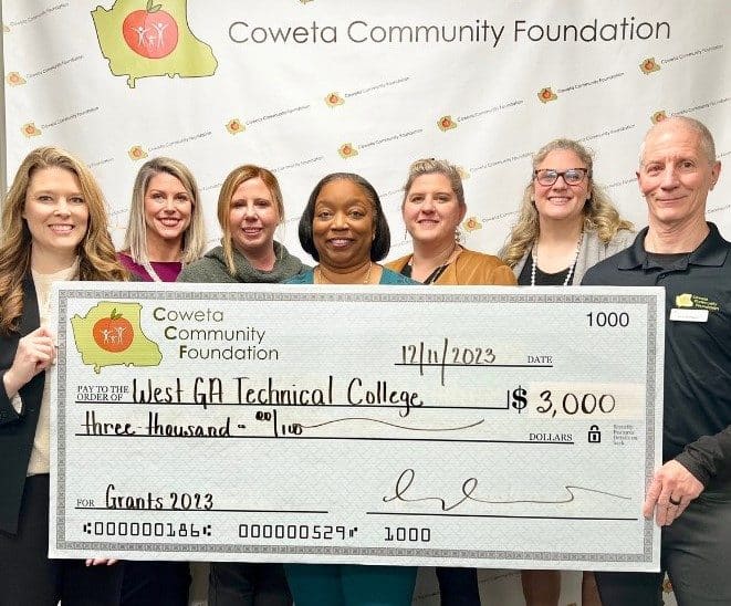 Ashley Akins, WGTC Foundation Coordinator; Dr. Tonya Whitlock, VP of Student Affairs; Brittney Wells, WGTC Foundation Executive Director, and Melinda Hofius, Dean of Students accept a check from members of the Coweta Community Foundation. The grant will support the College’s Project CARE initiative.