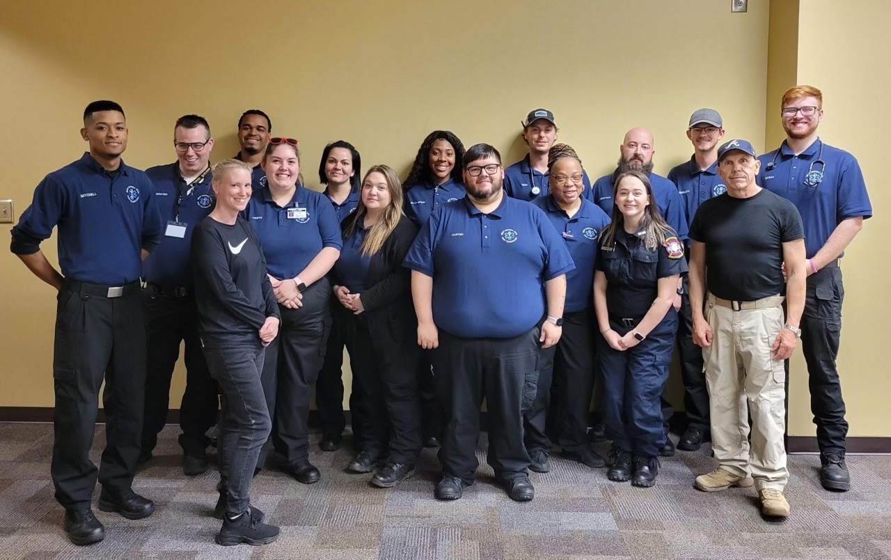 EMT students in uniform with instructors
