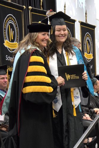 Gabrien Eng Receives Her Degree From Wgtc President Dr. Julie Post 