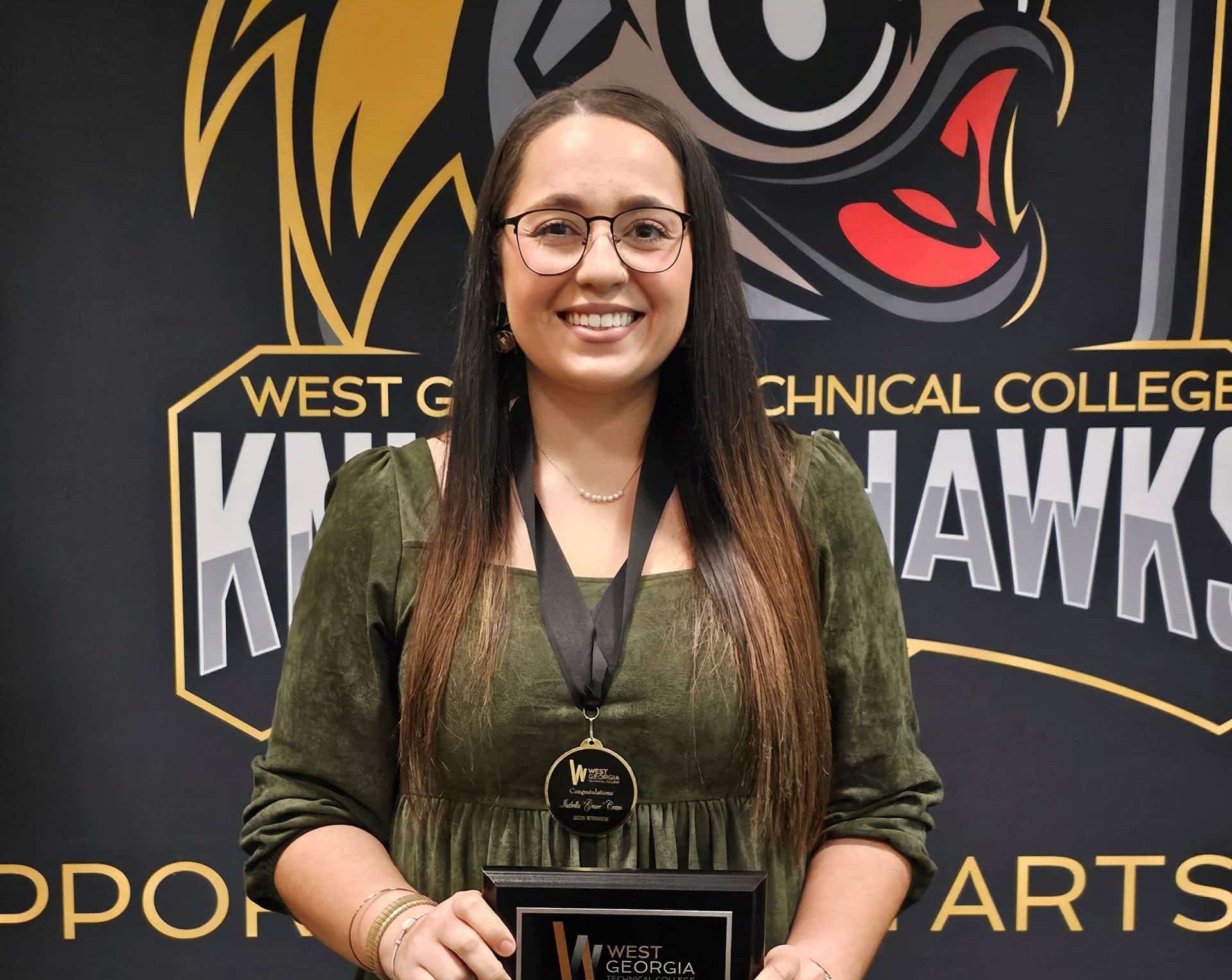 Grace Crews (002) Grace Crews holding award