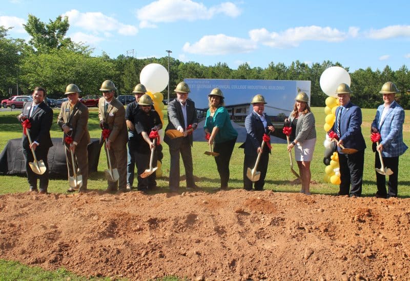 industry partners shoveling dirt at the ceremony