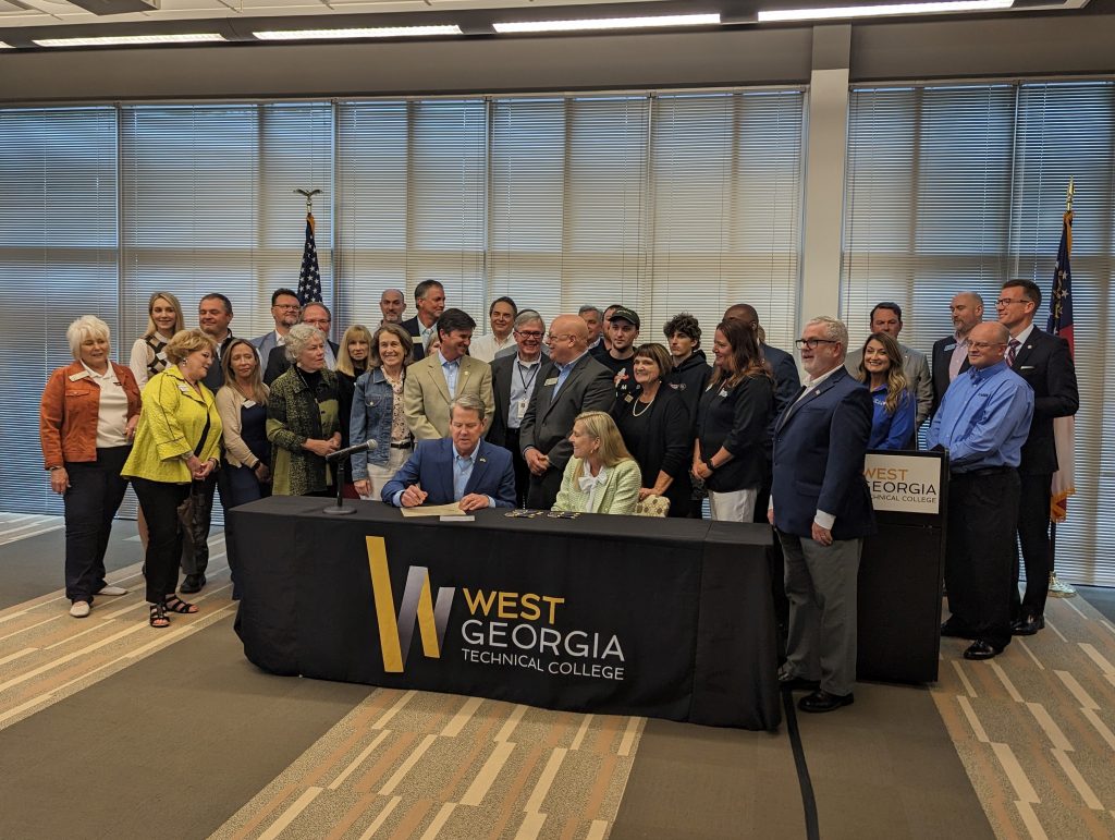 Gov. Kemp sigining a bill