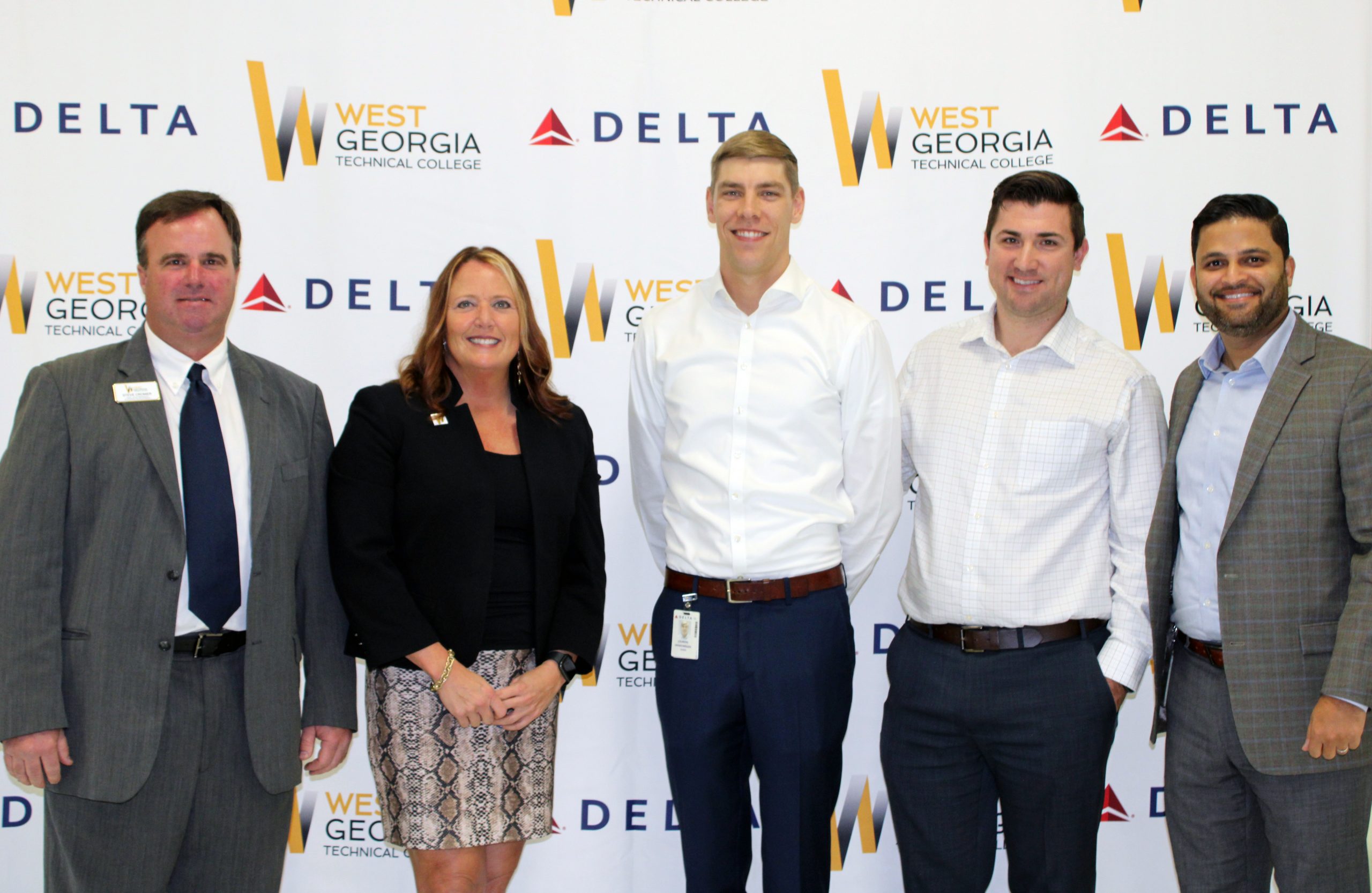 WGTC and Delta employees standing