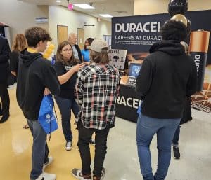 Students speak with representatives from Duracell during West Georgia Manufacturing Day
