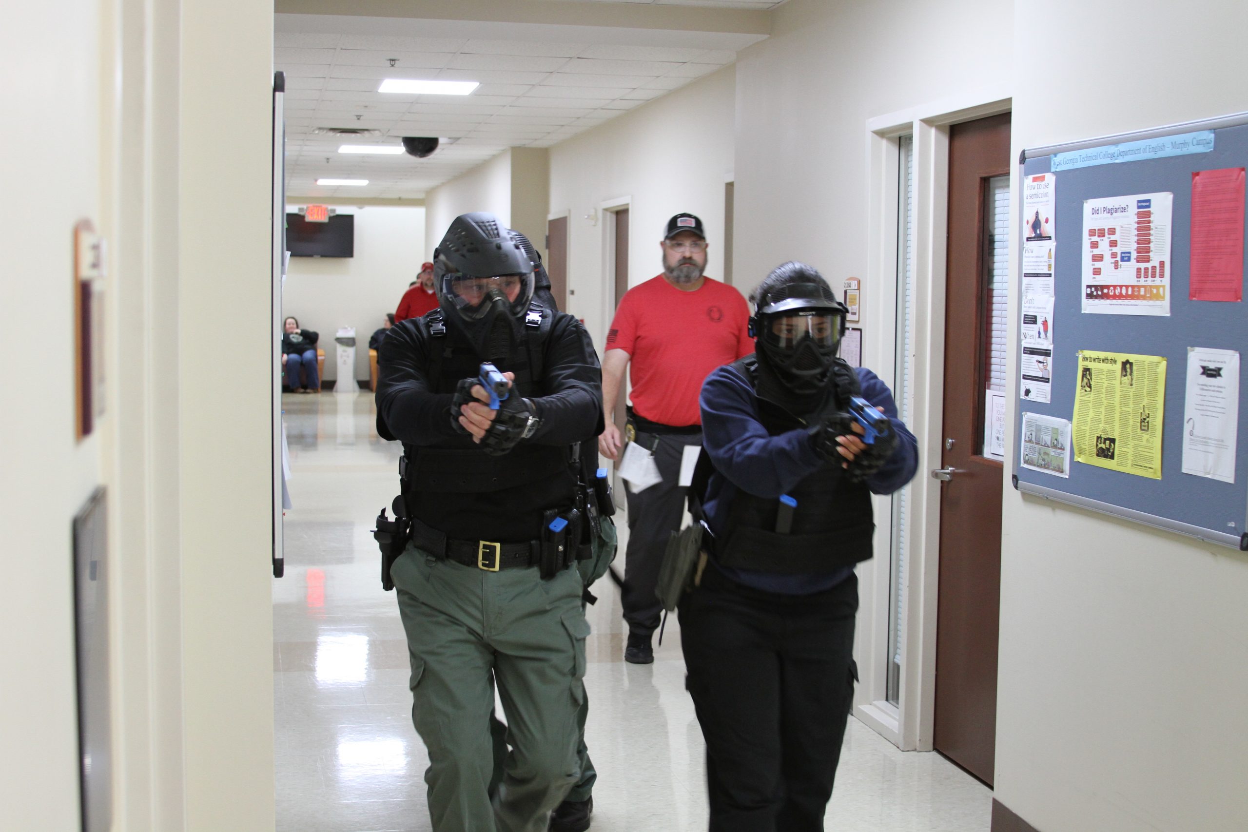 officer trainees in gear training in hallway