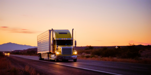 tractor trailer driving on road