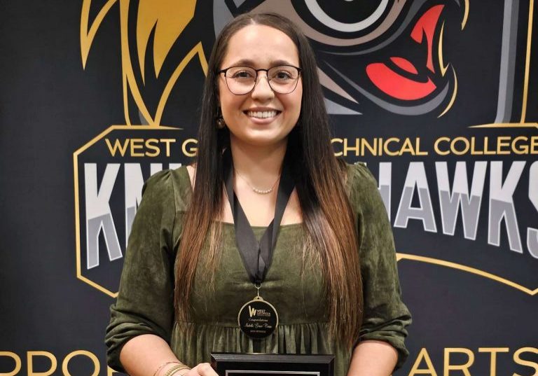 Grace Crews (002) Grace Crews holding award