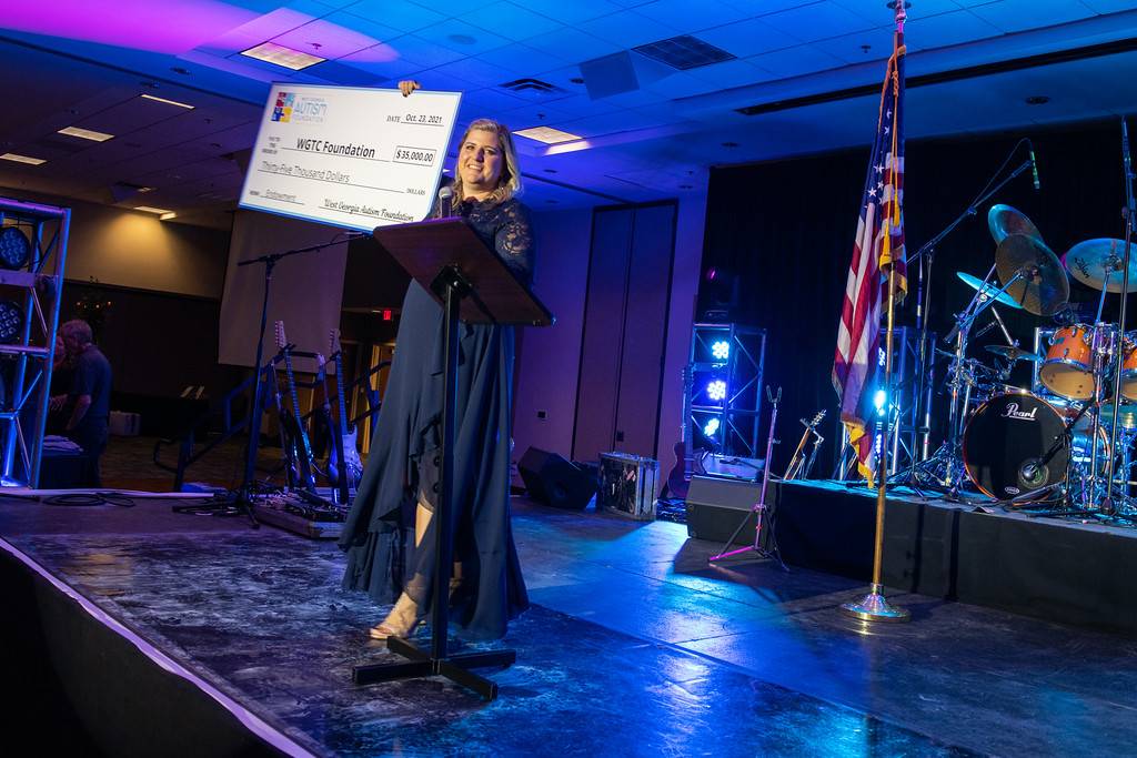 black tie and boots event big check